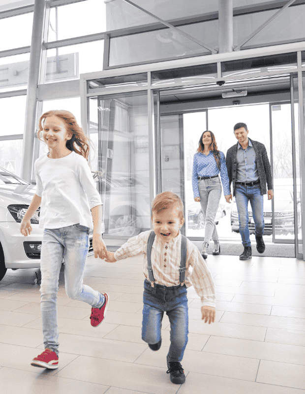 Family buying a car at a dealership